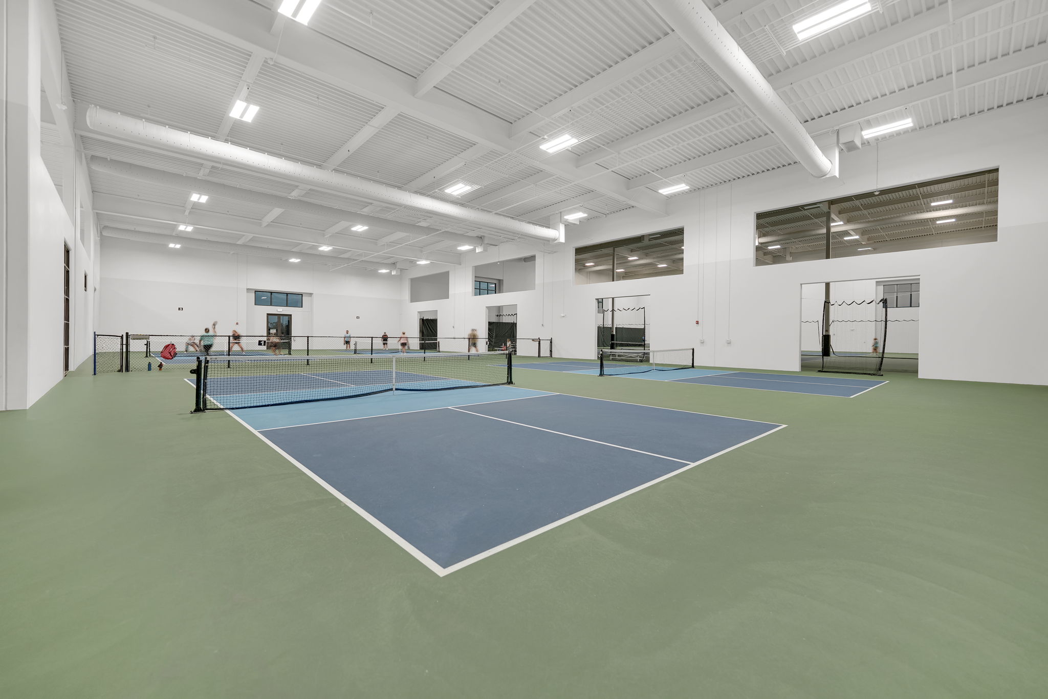 Indoor pickleball and tennis courts at Verdana Village