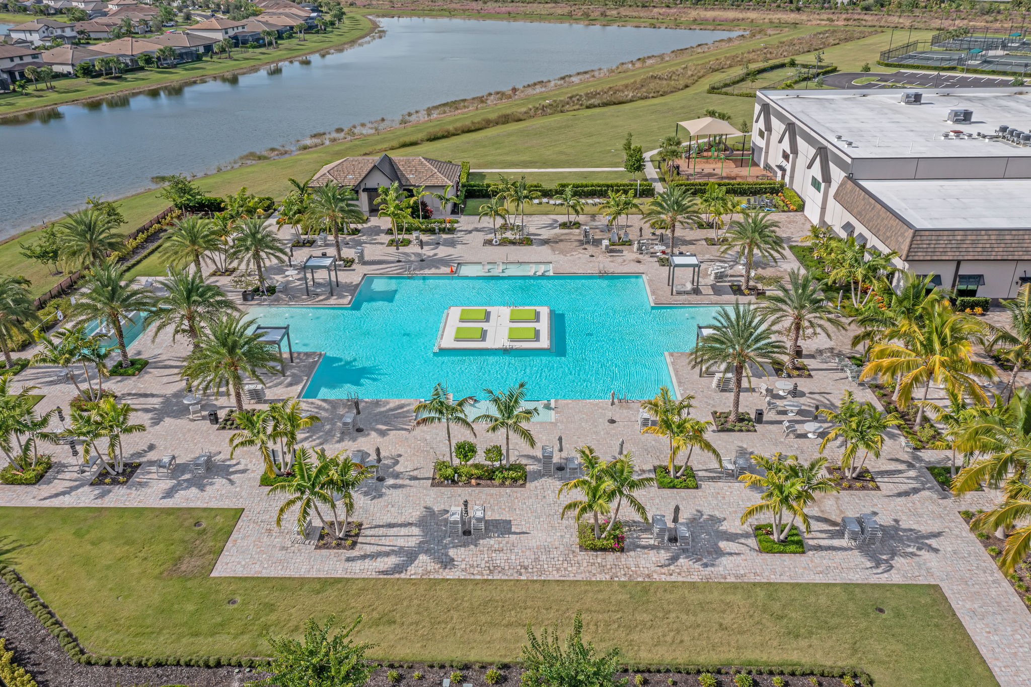Aerial view of the Verdana Village resort pool and amenity center in Estero, Florida